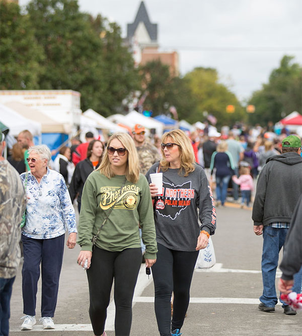People walk Main St. during the Harvest and Herb Festival