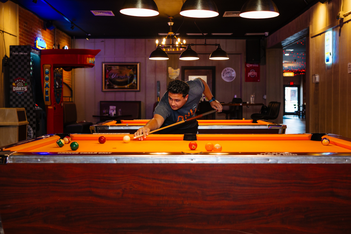 Students playing pool at the Regal Beagle