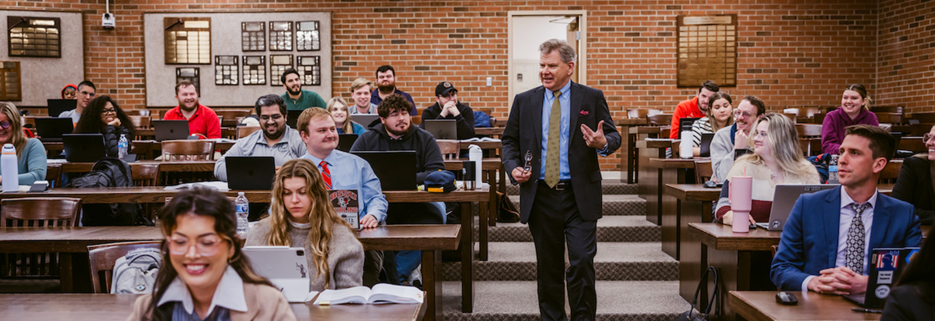 Dean Ward walking in a classroom